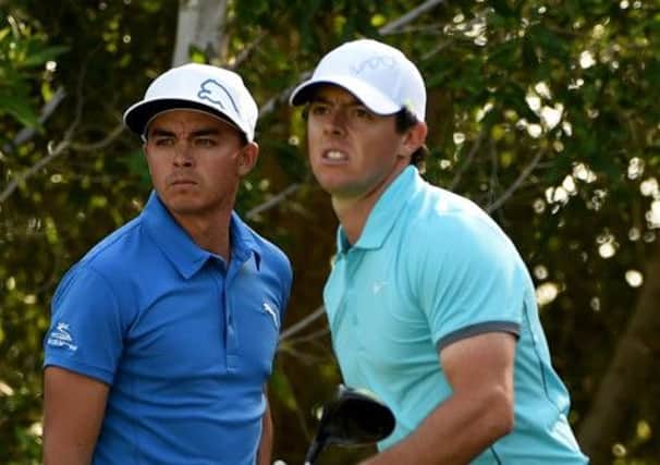 Rickie Fowler and Rory McIlroy locked horns in Abu Dhabi this week. Picture: Ross Kinnaird/Getty Images