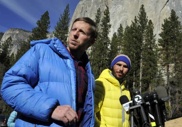 Tommy Caldwell, left, and Kevin Jorgeson stand in front of the peak known among climbers as El Cap. Picture: AP