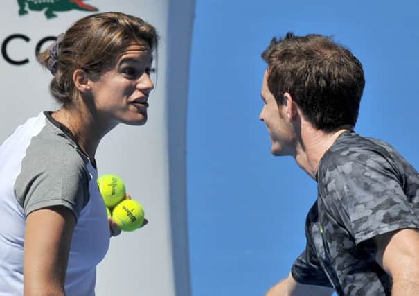 Andy Murray jokes with his coach Amelie Mauresmo as he fine-tunes his preparations for the Australian Open. Picture: AFP/Getty