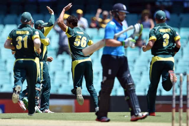 Australia celebrate as England opener Ian Bell walks back to the pavilion after being dismissed. Picture: Getty Images