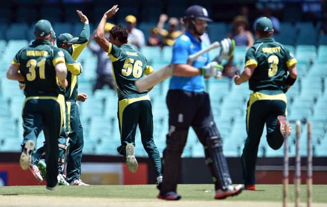 Australia celebrate as England opener Ian Bell walks back to the pavilion after being dismissed. Picture: Getty Images