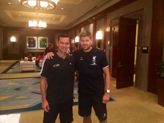 Stephen Glass, left, with Steven Gerrard during the Englishmans visit to the US with Liverpool last year