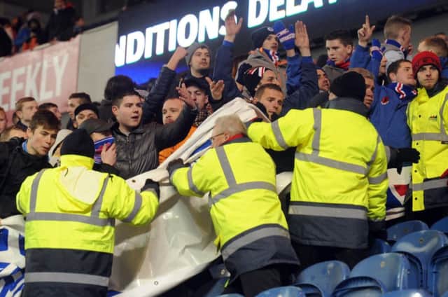 Rangers fans show their frustration after the match against Hearts is abandoned. Picture: Lisa Ferguson
