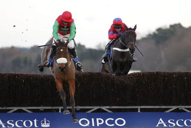Noel Fehily on Dodging Bullets, left, clears the last to win from Sprinter Sacre with Barry Geraghty on board at Ascot. Picture: Getty