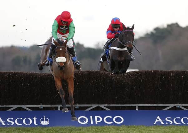 Noel Fehily on Dodging Bullets, left, clears the last to win from Sprinter Sacre with Barry Geraghty on board at Ascot. Picture: Getty