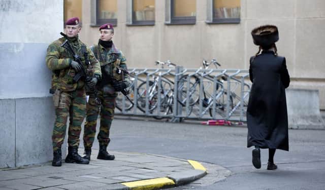 Belgian para-commandos patrol near a synagogue in Antwerp. Picture: AP