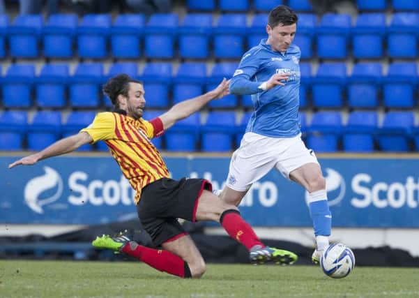 Partick Thistle's Danny Seabourne (left) tackles Michael O'Halloran. Picture: SNS Group
