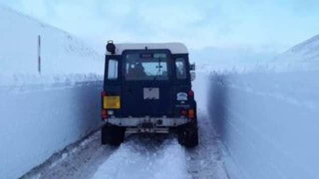 A Snowcore Land Rover drives through the ploughed snow in Glenshee yesterday. Picture: Snowcore
