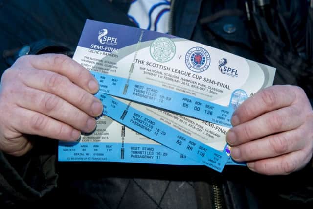 Rangers fans collect their tickets. Picture: SNS
