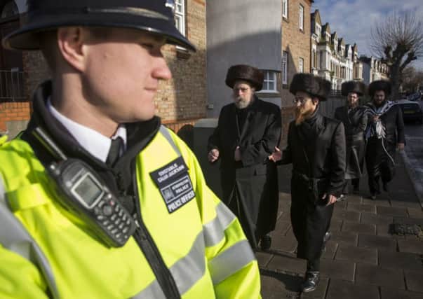Police on duty in the Stamford Hill area of London, which is predominantly a Hasidic Jewish community. Picture: Getty