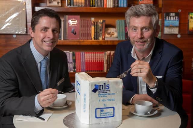 John McNiven, area retail manager for Saltire Hospitality, and John Coll, head of access at NLS, celebrate the deal
