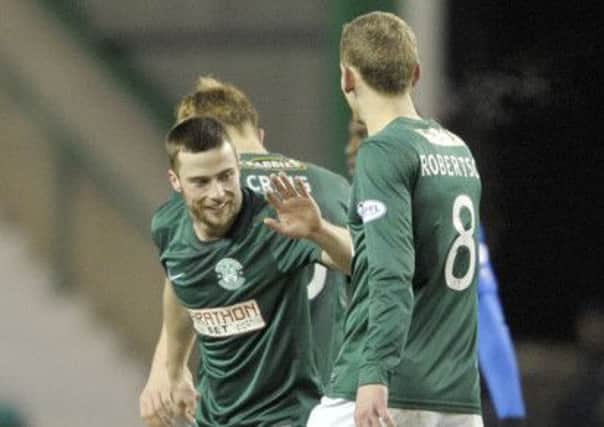 Lewis Stevenson celebrates his rare strike with fellow goalscorer Scott Robertson at Easter Road. Picture: Ian Rutherford