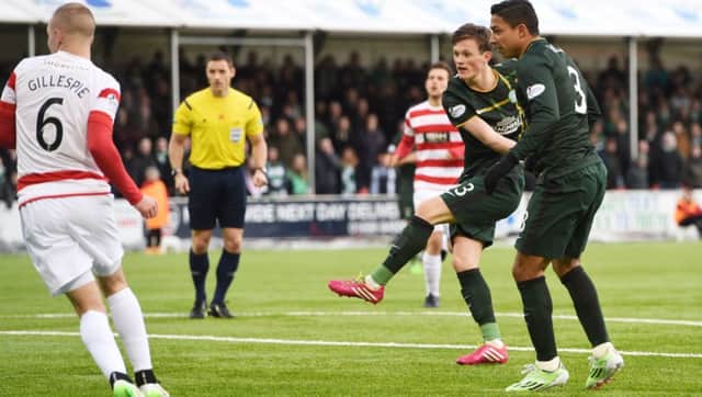 Emilio Izaguirre, right, looks on as team-mate Liam Henderson fires home Celtics second goal at Hamilton. Picture: SNS