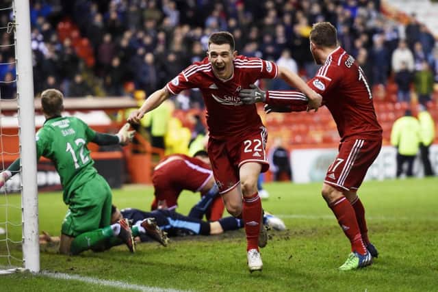 Ryan Jack wheels away in jubilation after forcing home a stoppage-time leveller. Picture: SNS