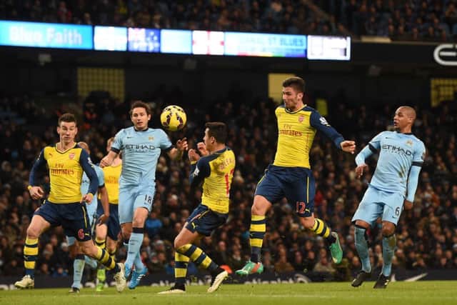 Arsenals French striker Olivier Giroud heads home his sides second goal. Picture: Getty