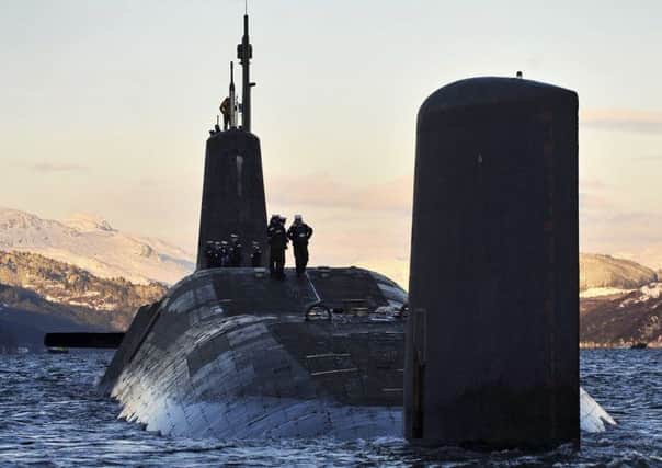 Trident submarines, like those at Faslane, carry up to 16 missiles, each with 12 nuclear warheads. Picture: Crown Copyright