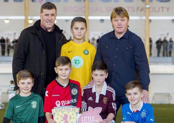 Mark McGhee, left, and Stuart McCall were at Ravenscraig yesterday to watch young hopefuls playing in a Primary Seven festival. Picture: SNS