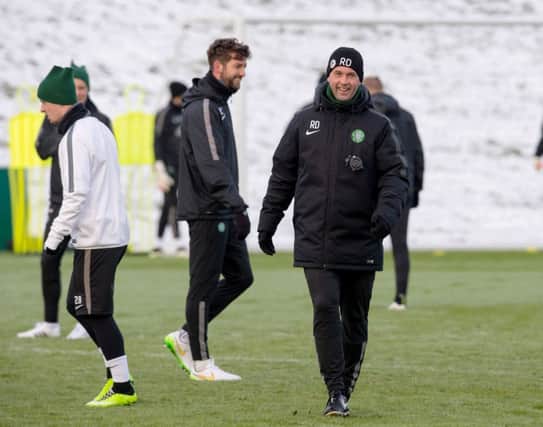 A relaxed Ronny Deila at training yesterday as his side prepares to play Motherwell at Celtic Park tomorrow. Picture: SNS