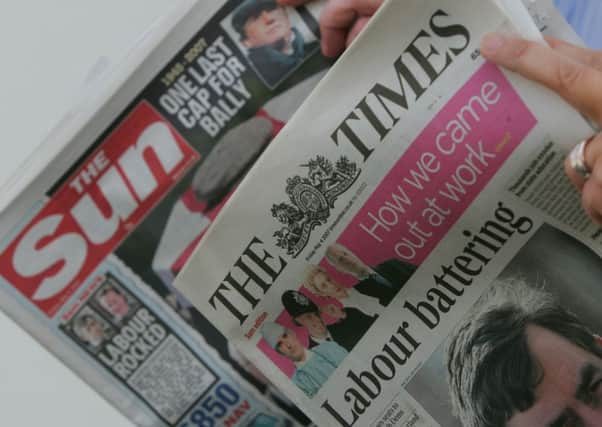 The Sun newspaper, left, has reportedly dropped their 44-year-old Page 3 feature. Picture: AP