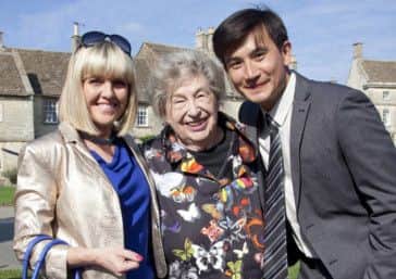 Writer Marion Chesney (M C Beaton) on the set of Agatha Raisin with Ashley Jensen (Agatha Raisin) and Matt McCooey (DC Bill Wong). Picture: Contributed