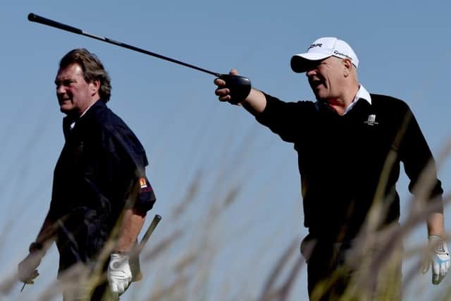 Former Scotland striker Andy Gray directs ex-England midfielder Glenn Hoddle during the pro-am at the Qatar Masters. Picture: Getty