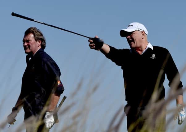 Former Scotland striker Andy Gray directs ex-England midfielder Glenn Hoddle during the pro-am at the Qatar Masters. Picture: Getty