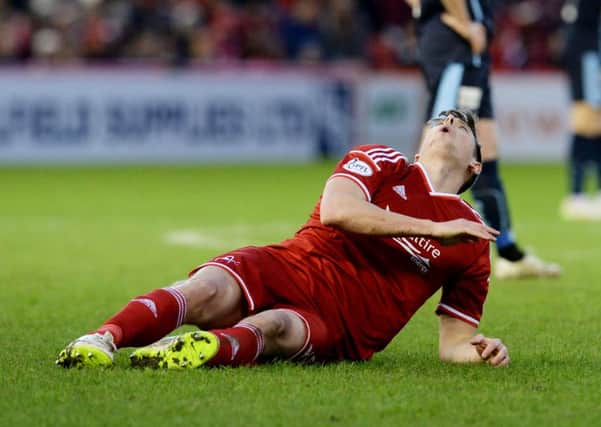 Ash Taylor sustained an injury during Aberdeen's dramatic 3-3 draw with Dundee. Picture: SNS