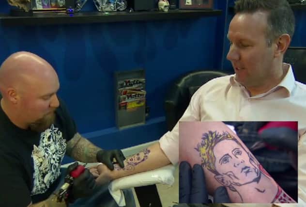 Craig Burley getting inked and, inset, the finished article. Picture: Contributed