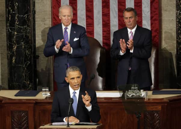Vice President Joe Biden and House Speaker John Boehner of Ohio applaud President Barack Obama on Capitol Hill during his State of the Union address. Picture: AP