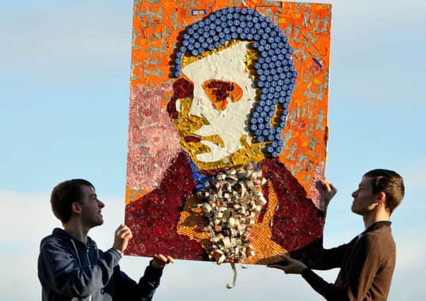 Students Gary Ball and Mark Lawrence show off the collage outside Holyrood. Picture: Ian Rutherford