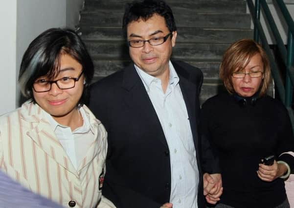 Abdul Razak Baginda, centre, was cleared of involvement in the murder of Altantuya Shaariibuu, whose body was blown up with explosives in a jungle clearing. Picture: Getty