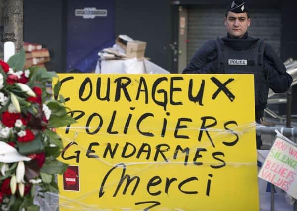 A sign outside the Hyper Cacher kosher supermarket in Paris, where Amedy Coulibaly took hostages earlier this month. The placard reads: 'Courageous police and law-enforcement thank you'. Picture: Getty