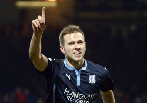 Dundee's Greg Stewart celebrates after slotting it home from the spot to put his side 1-0 up. Picture: SNS
