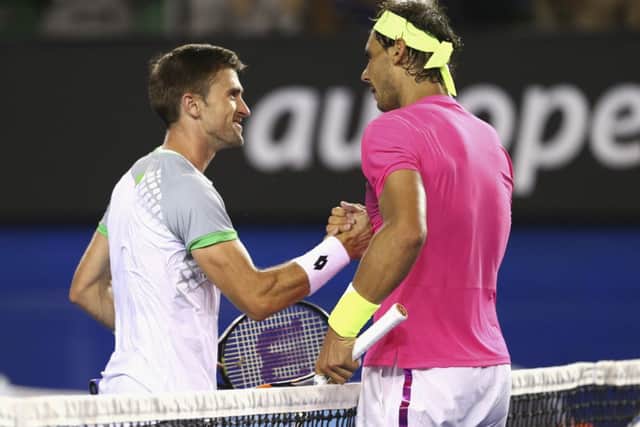 Tim Smyczek of the United States congratulates Rafael Nadal. Picture: Getty
