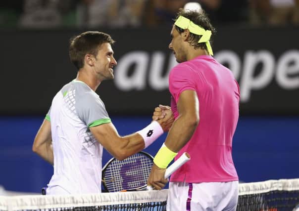 Tim Smyczek of the United States congratulates Rafael Nadal. Picture: Getty