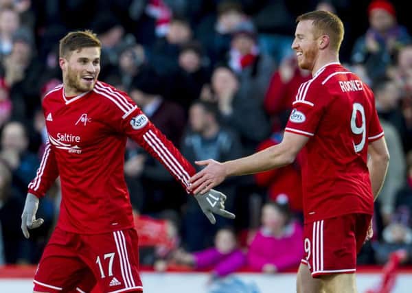 David Goodwillie, left, has extended his contract at Aberdeen. Picture: SNS