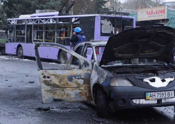 An artillery strike on a trolleybus in the centre of Donetsk killed 13 civilians and injured many more. Picture: Tass/Barcroft Media