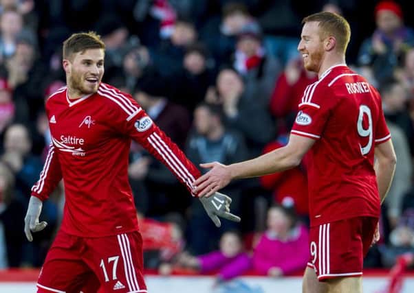 David Goodwillie celebrates his goal with fellow Aberdeen frontman Adam Rooney during the 3-3 draw with Dundee. Picture: SNS