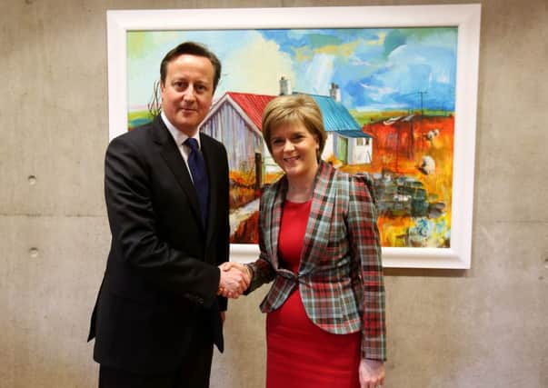 First Minister Nicola Sturgeon shakes hands with Prime Minister David Cameron at the Scottish Parliament. Picture: Getty