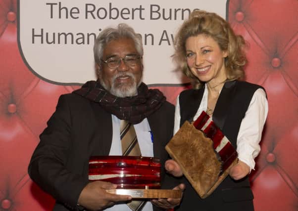 Olivia Giles is accompanied by runner-up Sompop Jantraka at the Robert Burns Humanitarian Awards. Picture: Contributed