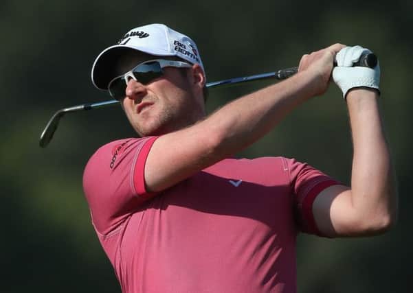 Marc Warren plays an iron shot during his round of 67              Picture: Getty