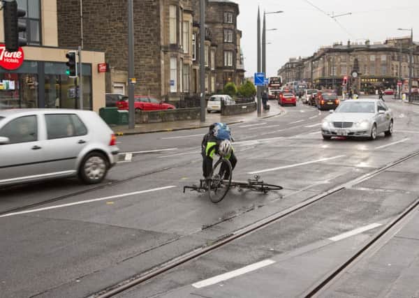 There have been a number of incidents of cyclists falling off their bikes due to slippery tram tracks. Picture: TSPL