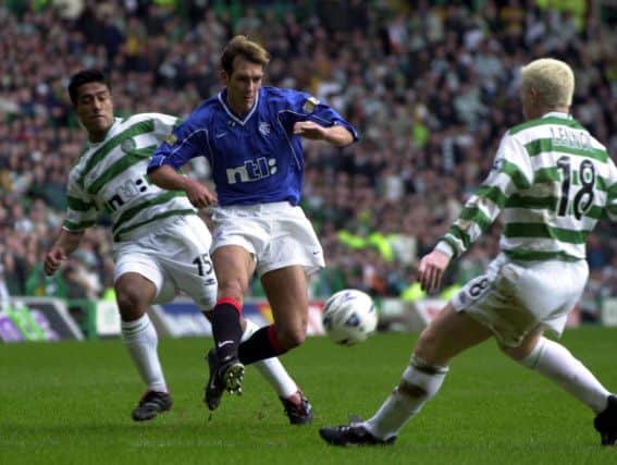 Fernando Ricksen is blocked by Bobby Petta and Neil Lennon in a 2001 Old Firm derby. Picture: Robert Perry