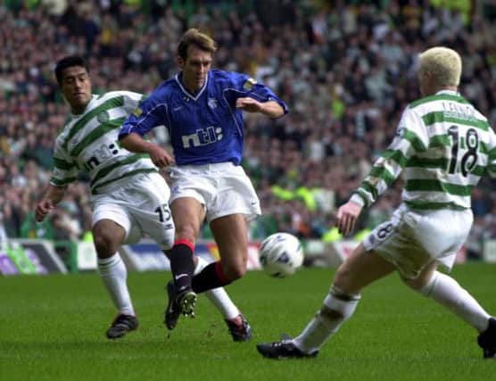 Fernando Ricksen is blocked by Bobby Petta and Neil Lennon in a 2001 Old Firm derby. Picture: Robert Perry