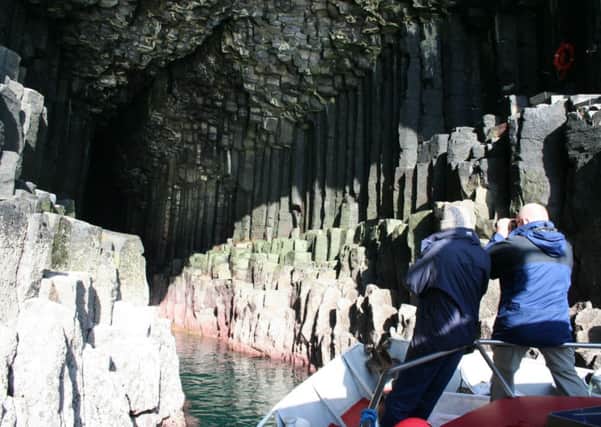 Tourists in Fingals Cave. Boat operator Iain Morrison says many dont know what to expect from Scotlands wild places. Picture: TSPL
