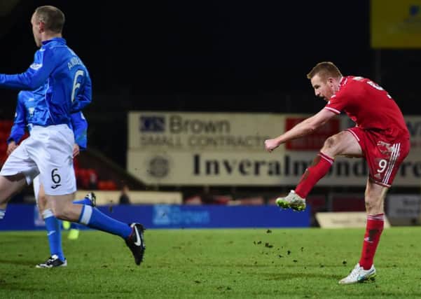 Aberdeen ace Adam Rooney fires into the back of the net to equalise for his side 1-1. Picture: SNS