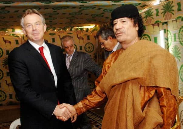 Former PM Tony Blair meeting then Libyan leader Colonel Gaddafi at his desert base. Picture: PA