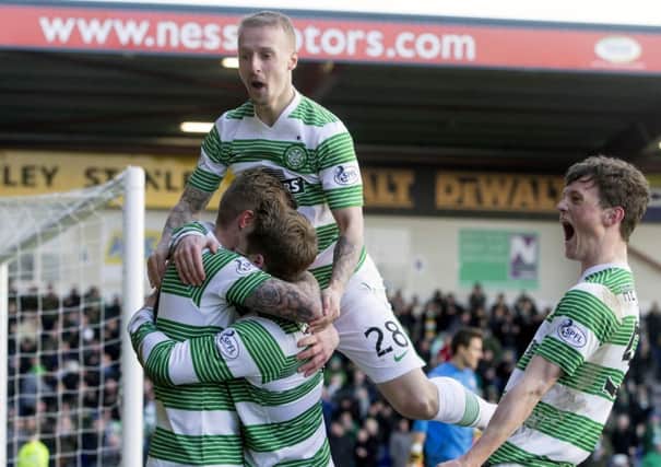 Celtic's Kris Commons celebrates his goal with teammates. Picture: PA