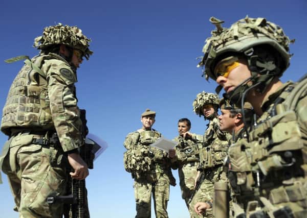 Troops from 1SCOTS in Helmand. Critics say savings should fund front-line capability. Picture: Greg Macvean