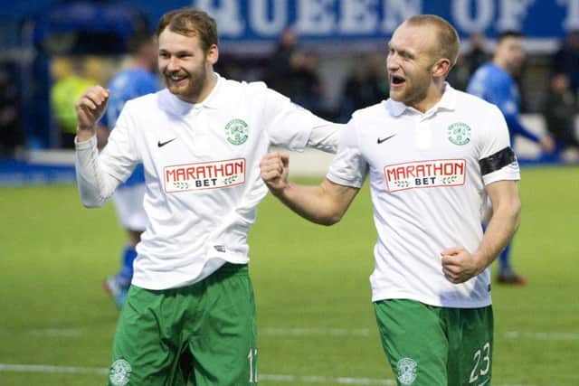 Hibernian's Martin Boyle (left) celebrates with goalscorer Dylan McGeouch as his side go in front. Picture: SNS